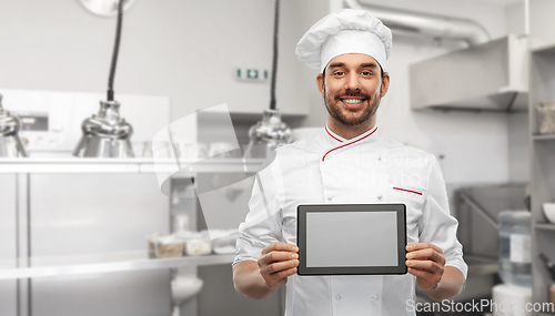 Image of happy smiling male chef with tablet pc at kitchen