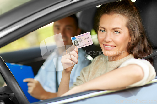 Image of car driving instructor and driver with license