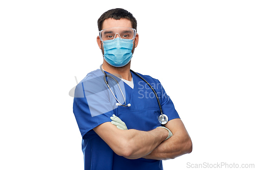 Image of male doctor in goggles, mask and gloves