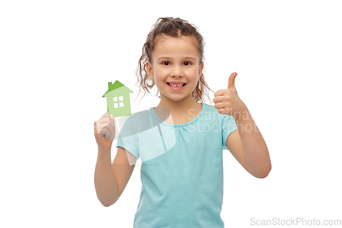 Image of happy girl with green house icon showing thumbs up