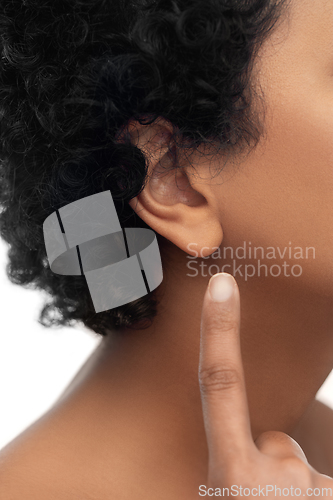 Image of close up of african american woman's ear