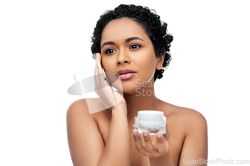 Image of young african american woman with moisturizer