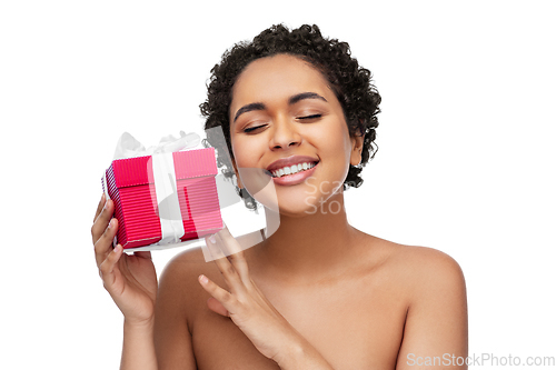 Image of portrait of young african american woman with gift