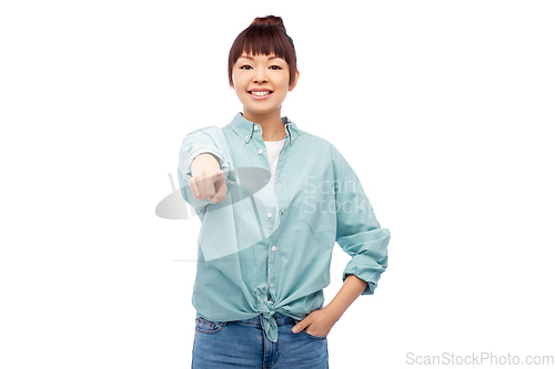 Image of happy smiling asian woman pointing to camera