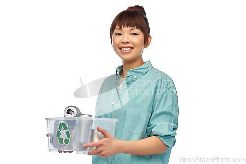 Image of smiling young asian woman sorting metallic waste