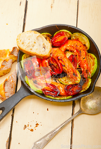 Image of roasted shrimps with zucchini and tomatoes