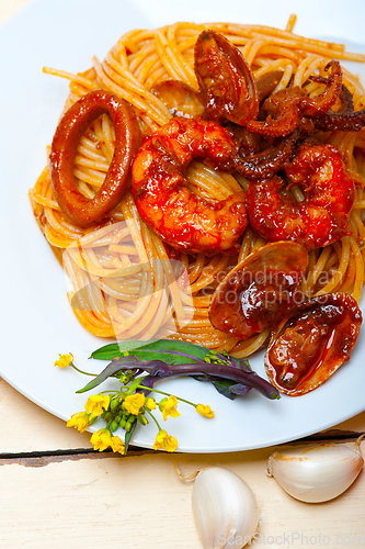 Image of Italian seafood spaghetti pasta on red tomato sauce