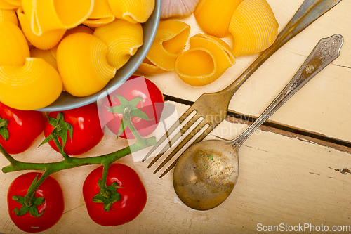 Image of Italian snail lumaconi pasta with tomatoes