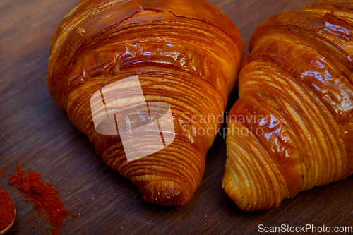 Image of french traditiona croissant brioche butter bread  on wood