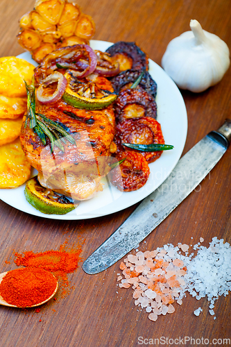 Image of roasted grilled BBQ chicken breast with herbs and spices