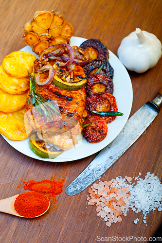 Image of roasted grilled BBQ chicken breast with herbs and spices