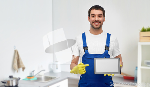 Image of male cleaner showing tablet pc at at kitchen