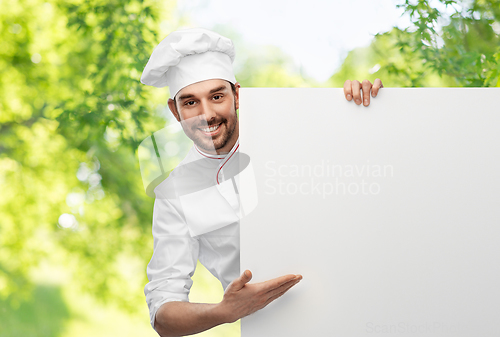 Image of happy smiling male chef with big white board