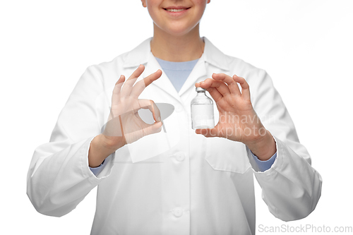 Image of close up of doctor with medicine showing ok sign