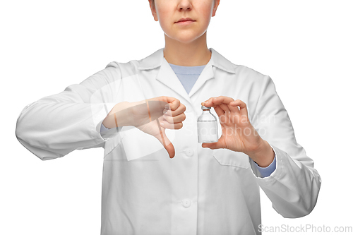 Image of female doctor with medicine showing thumbs down