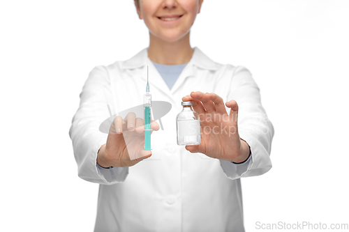 Image of close up of doctor with medicine and syringe