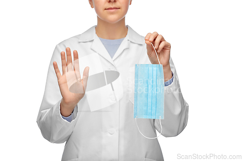 Image of female doctor with mask showing stop gesture