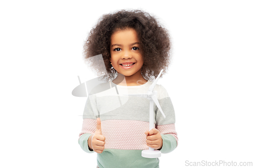 Image of happy african american girl with toy wind turbine