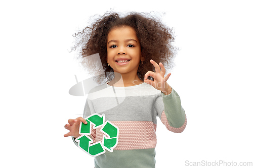 Image of african american girl holding green recycling sign