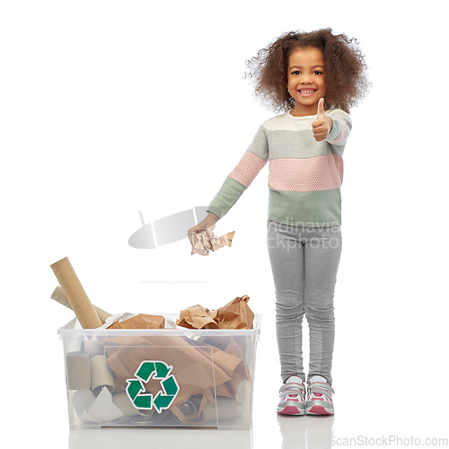 Image of smiling african american girl sorting paper waste