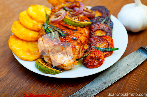 Image of roasted grilled BBQ chicken breast with herbs and spices