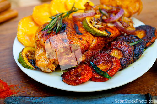 Image of roasted grilled BBQ chicken breast with herbs and spices