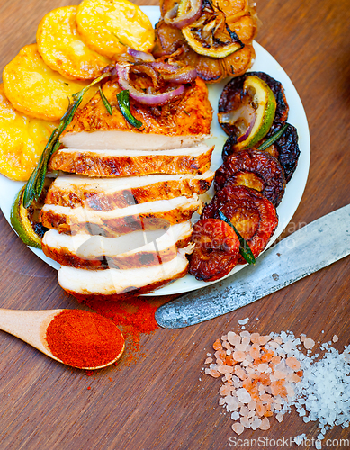 Image of roasted grilled BBQ chicken breast with herbs and spices