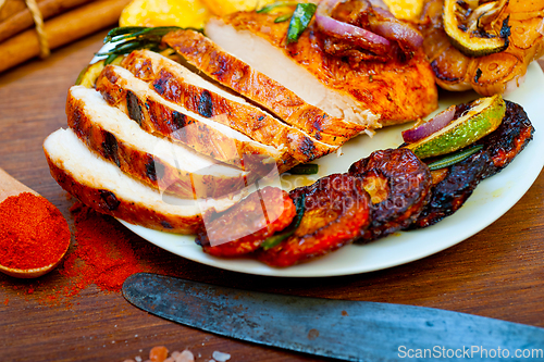 Image of roasted grilled BBQ chicken breast with herbs and spices