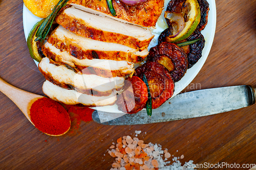 Image of roasted grilled BBQ chicken breast with herbs and spices