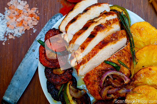 Image of roasted grilled BBQ chicken breast with herbs and spices