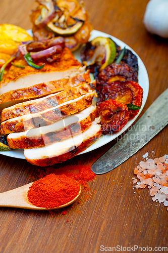 Image of roasted grilled BBQ chicken breast with herbs and spices