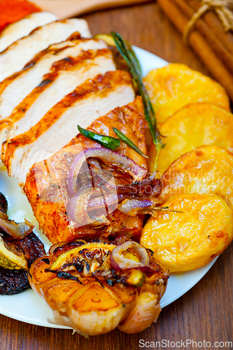 Image of roasted grilled BBQ chicken breast with herbs and spices