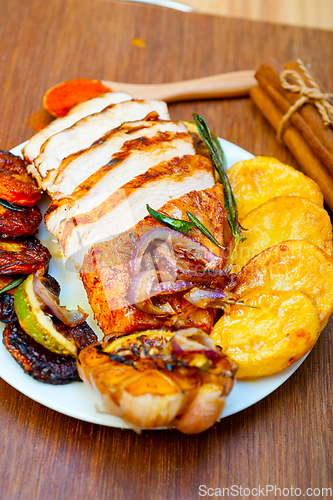 Image of roasted grilled BBQ chicken breast with herbs and spices