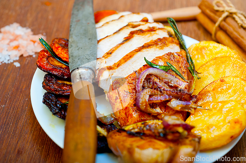 Image of roasted grilled BBQ chicken breast with herbs and spices