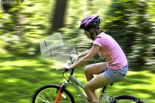 Image of Teenage girl on a bicycle