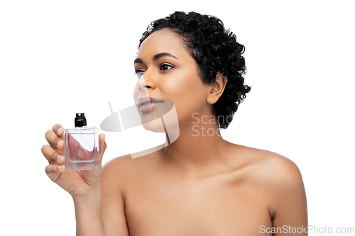 Image of young african american woman with perfume