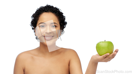 Image of happy african american woman holding green apple
