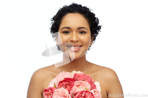 Image of portrait of african american woman with flowers