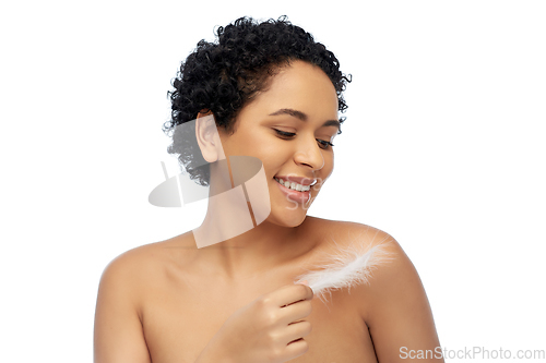 Image of happy african american woman with feather