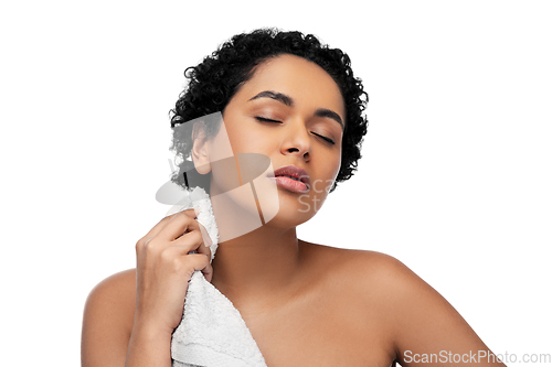 Image of young african american woman with bath towel