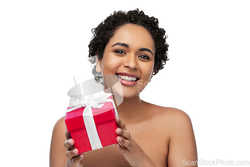 Image of portrait of young african american woman with gift