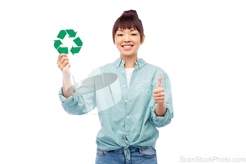 Image of smiling asian woman holding green recycling sign