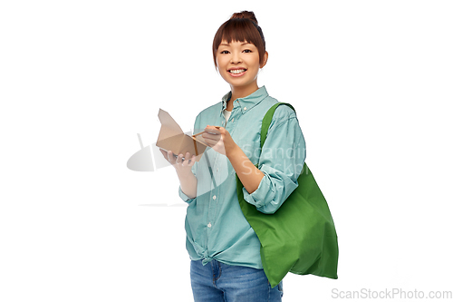 Image of asian woman with reusable bag for food and wok