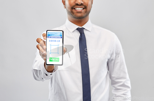 Image of man with virtual immunity passport on smartphone