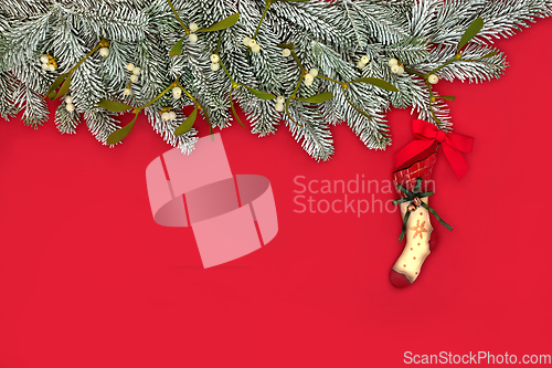 Image of Christmas Eve Red Background with Retro Stocking Tree Decoration