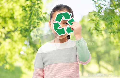 Image of smiling girl holding green recycling sign