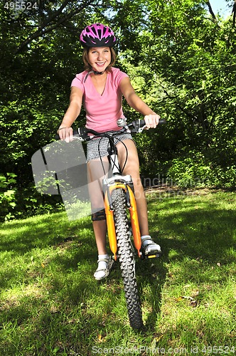 Image of Teenage girl on a bicycle