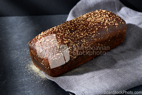 Image of homemade craft bread with seeds on table