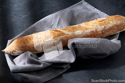 Image of close up of baguette bread on kitchen towel