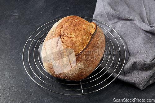 Image of homemade craft bread on stand on table